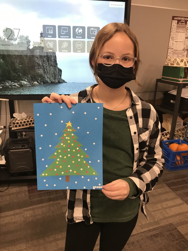 Student Showing Off Her Tree