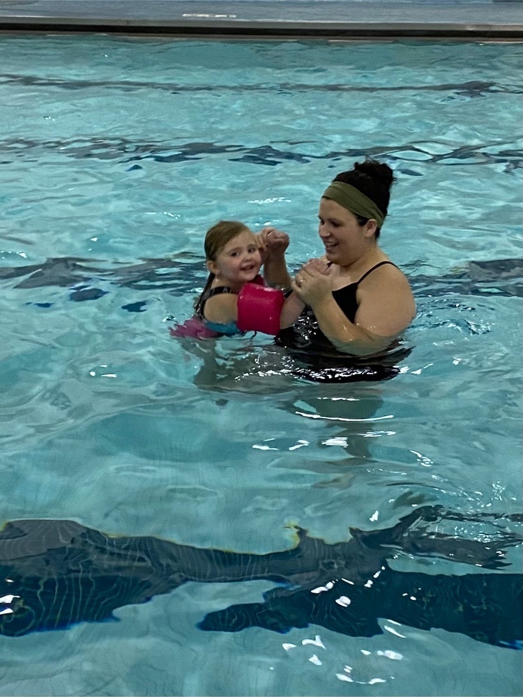 mom and daughter swimming