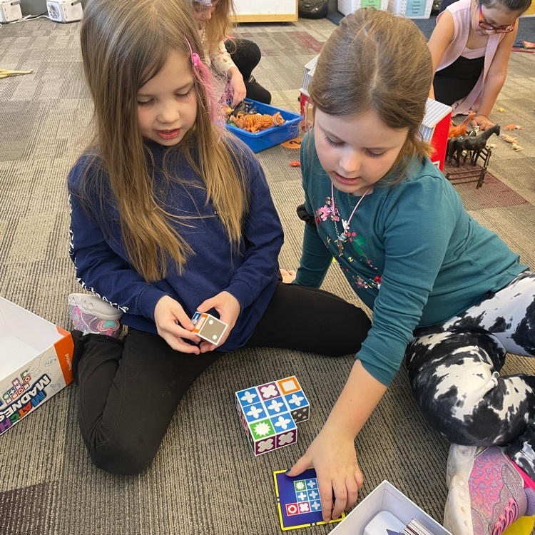 The goal of this game is to match the card and your squares. The only thing is - we are not sure which way the cubes go when we put them together. great problem solving skills at work.