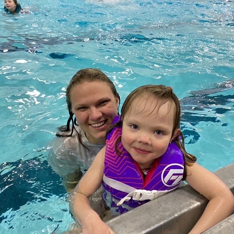 mom and daughter swimming 