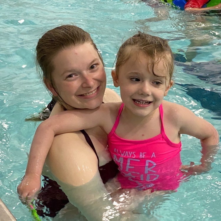 mother and daughter swimming.  